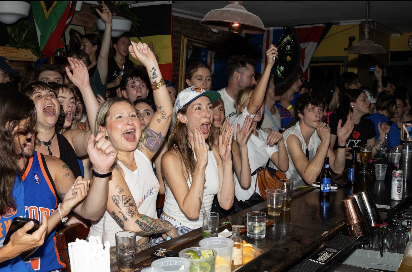Fans cheering at the bar during a St. Dymphna's watch party