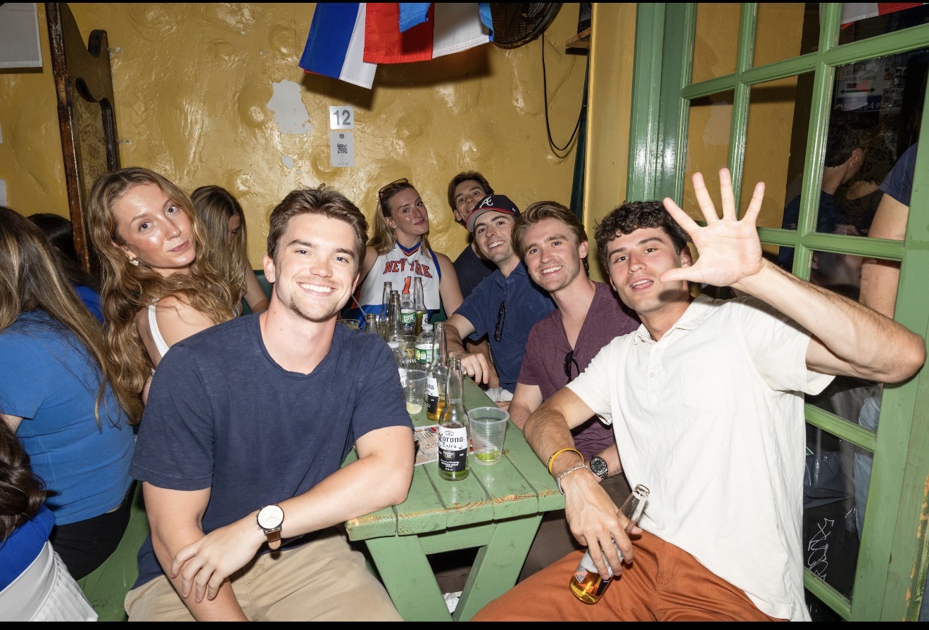 Fans gathered around a table at St. Dymphna's